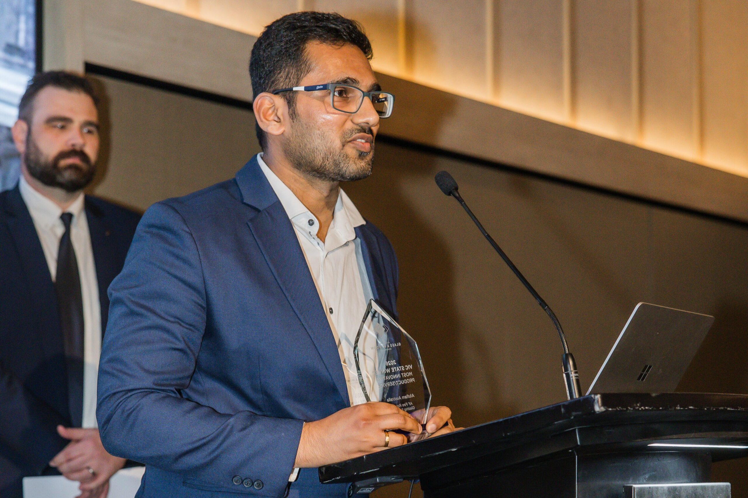 Aluflam Australia representative speaking at the 2026 AGWA Victoria Design Awards